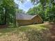 Exterior home view with lush green surroundings at 5755 Hendrix Rd, Cumming, GA 30040