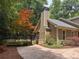 A beautiful home exterior with a well-manicured yard and a mature Japanese Maple at 5755 Hendrix Rd, Cumming, GA 30040