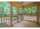 Relaxing screened-in porch with views of the wooded backyard at 5755 Hendrix Rd, Cumming, GA 30040
