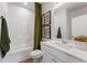 This bathroom features a shower-tub combo with neutral decor at 732 Hedwig Dr, Mcdonough, GA 30252