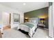 This bedroom features an accent wall and gray carpeting at 732 Hedwig Dr, Mcdonough, GA 30252