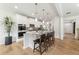 Modern kitchen featuring white cabinets, stainless steel appliances, and a center island with seating at 732 Hedwig Dr, Mcdonough, GA 30252