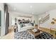 Open-concept living room boasts hardwood floors and seamless flow to the modern kitchen at 732 Hedwig Dr, Mcdonough, GA 30252