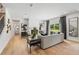 Bright living room featuring hardwood floors, contemporary decor, and access to the outdoors at 732 Hedwig Dr, Mcdonough, GA 30252