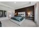 Elegant main bedroom showcasing a dark accent wall, neutral carpet, and ensuite bathroom access at 732 Hedwig Dr, Mcdonough, GA 30252