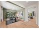 Stylish home office featuring sleek black shelving, contemporary artwork, and neutral green walls at 732 Hedwig Dr, Mcdonough, GA 30252
