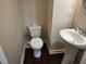 Neat half bath with a pedestal sink and toilet, perfect for guests at 10650 Allon Cv # 137, Alpharetta, GA 30022