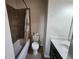 Cozy bathroom featuring a tub with tile surround and a single vanity at 10650 Allon Cv # 137, Alpharetta, GA 30022