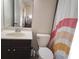 Bright bathroom featuring neutral paint, tile floor and a sink with a large mirror at 10650 Allon Cv # 137, Alpharetta, GA 30022