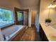 Elegant bathroom with a soaking tub, a separate shower, and dual vanities at 10650 Allon Cv # 137, Alpharetta, GA 30022