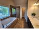 Luxurious bathroom with soaking tub, separate shower, and double vanity sinks at 10650 Allon Cv # 137, Alpharetta, GA 30022