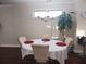 Inviting dining room featuring hardwood floors, a chandelier, and natural light at 10650 Allon Cv # 137, Alpharetta, GA 30022