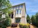 Beautiful two-story townhouse with brick exterior and manicured landscaping at 10650 Allon Cv # 137, Alpharetta, GA 30022