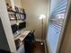 Compact home office space with built-in shelves and a bright window at 10650 Allon Cv # 137, Alpharetta, GA 30022
