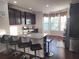 Modern kitchen with granite countertops, stainless steel appliances, and barstool seating at 10650 Allon Cv # 137, Alpharetta, GA 30022