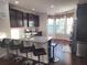 Modern kitchen featuring granite countertops, stainless steel appliances, and breakfast bar at 10650 Allon Cv # 137, Alpharetta, GA 30022
