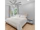 Bedroom features a king bed, ceiling fan, hardwood floors, and natural light from the window at 293 Ormond Se St, Atlanta, GA 30315