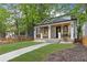 Charming home boasts a welcoming porch, manicured lawn, and craftsman details at 293 Ormond Se St, Atlanta, GA 30315
