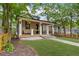 Charming home boasts a welcoming porch, manicured lawn, and craftsman details at 293 Ormond Se St, Atlanta, GA 30315