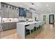 Gourmet kitchen features large island, stainless appliances and gray cabinets at 293 Ormond Se St, Atlanta, GA 30315