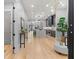 Open-concept living space with hardwood floors seamlessly connects to a modern kitchen at 293 Ormond Se St, Atlanta, GA 30315
