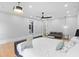 Bright and airy bedroom featuring a king bed, ceiling fan and an ensuite bathroom with modern fixtures at 293 Ormond Se St, Atlanta, GA 30315