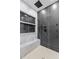Walk-in shower featuring a bench seat, rainfall shower head, body jets, and marble tile at 293 Ormond Se St, Atlanta, GA 30315