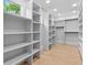 A walk-in closet featuring custom shelving, hardwood floors, and natural light at 293 Ormond Se St, Atlanta, GA 30315
