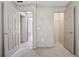 Bedroom with two doors, showing a closet and a view through to another room at 3510 Riviera Dr, Cumming, GA 30041