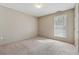 Serene bedroom featuring natural light from a window and neutral finishes at 3510 Riviera Dr, Cumming, GA 30041
