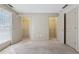 Bedroom featuring carpet and walk-in closets with open doors that reveal shelving at 3510 Riviera Dr, Cumming, GA 30041