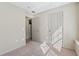 Charming bedroom highlighting neutral finishes, carpet, and closet space at 3510 Riviera Dr, Cumming, GA 30041