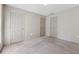 Comfortable bedroom with neutral walls, carpet, and multiple closet doors at 3510 Riviera Dr, Cumming, GA 30041