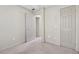 Cozy bedroom offering neutral walls, carpet, and multiple doors for easy access at 3510 Riviera Dr, Cumming, GA 30041