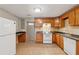 Well-equipped kitchen featuring classic wood cabinetry and essential appliances at 3510 Riviera Dr, Cumming, GA 30041