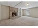 Inviting living room featuring a brick fireplace, neutral carpet, and natural light at 3510 Riviera Dr, Cumming, GA 30041