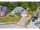 Aerial view of a well-maintained single story home with driveway and landscaped lawn in a residential neighborhood at 4368 Magnolia Bay Ln, Snellville, GA 30039