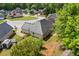 Aerial view of the house showcasing the roof and surrounding wooded neighborhood at 4368 Magnolia Bay Ln, Snellville, GA 30039