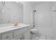 Bathroom features white cabinets and tile, plus a shower-tub combo at 4368 Magnolia Bay Ln, Snellville, GA 30039