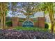 Entrance to Magnolia Manor community with sign, brick pillars, and well-maintained landscaping at 4368 Magnolia Bay Ln, Snellville, GA 30039
