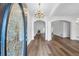 Inviting foyer with hardwood floors leads to a spacious living area with a fireplace, offering a warm welcome at 4368 Magnolia Bay Ln, Snellville, GA 30039