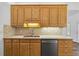 Kitchen featuring wood cabinets, stainless steel appliances, and a spacious countertop at 4368 Magnolia Bay Ln, Snellville, GA 30039