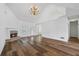 Spacious living room with vaulted ceilings, fireplace, wood floors, and large windows at 4368 Magnolia Bay Ln, Snellville, GA 30039