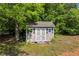 Outdoor shed offers great storage space and complements the home's exterior at 4368 Magnolia Bay Ln, Snellville, GA 30039