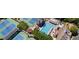 An aerial view of tennis courts, swimming pool, and neighborhood clubhouse at 5075 Briarstone Ridge Way, Alpharetta, GA 30022