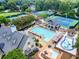Aerial view of the community pool, clubhouse, tennis courts, and pool at 5075 Briarstone Ridge Way, Alpharetta, GA 30022