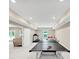 Finished basement featuring a ping pong table, exercise equipment, and seating at 5075 Briarstone Ridge Way, Alpharetta, GA 30022