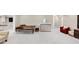 Spacious finished basement with a seating area, ping pong table, and bright, neutral colors at 5075 Briarstone Ridge Way, Alpharetta, GA 30022