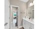 Bright bathroom with a modern vanity and fixtures at 5075 Briarstone Ridge Way, Alpharetta, GA 30022