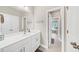 Modern bathroom featuring a white vanity and tile flooring at 5075 Briarstone Ridge Way, Alpharetta, GA 30022
